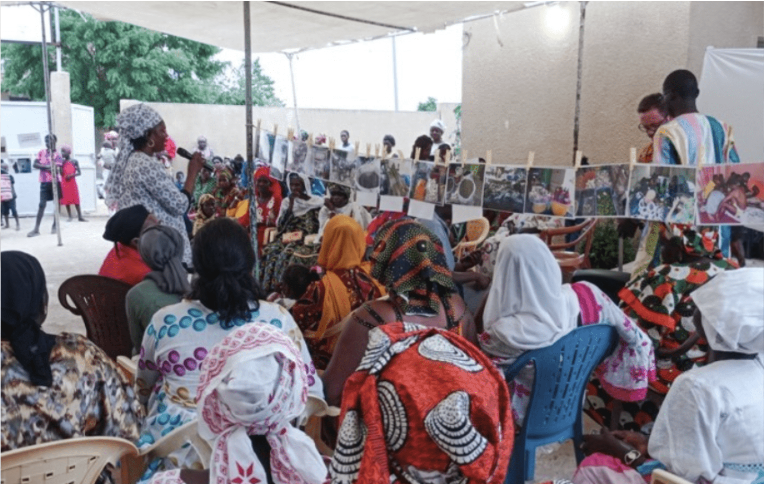 People sitting at a photography exhibit 