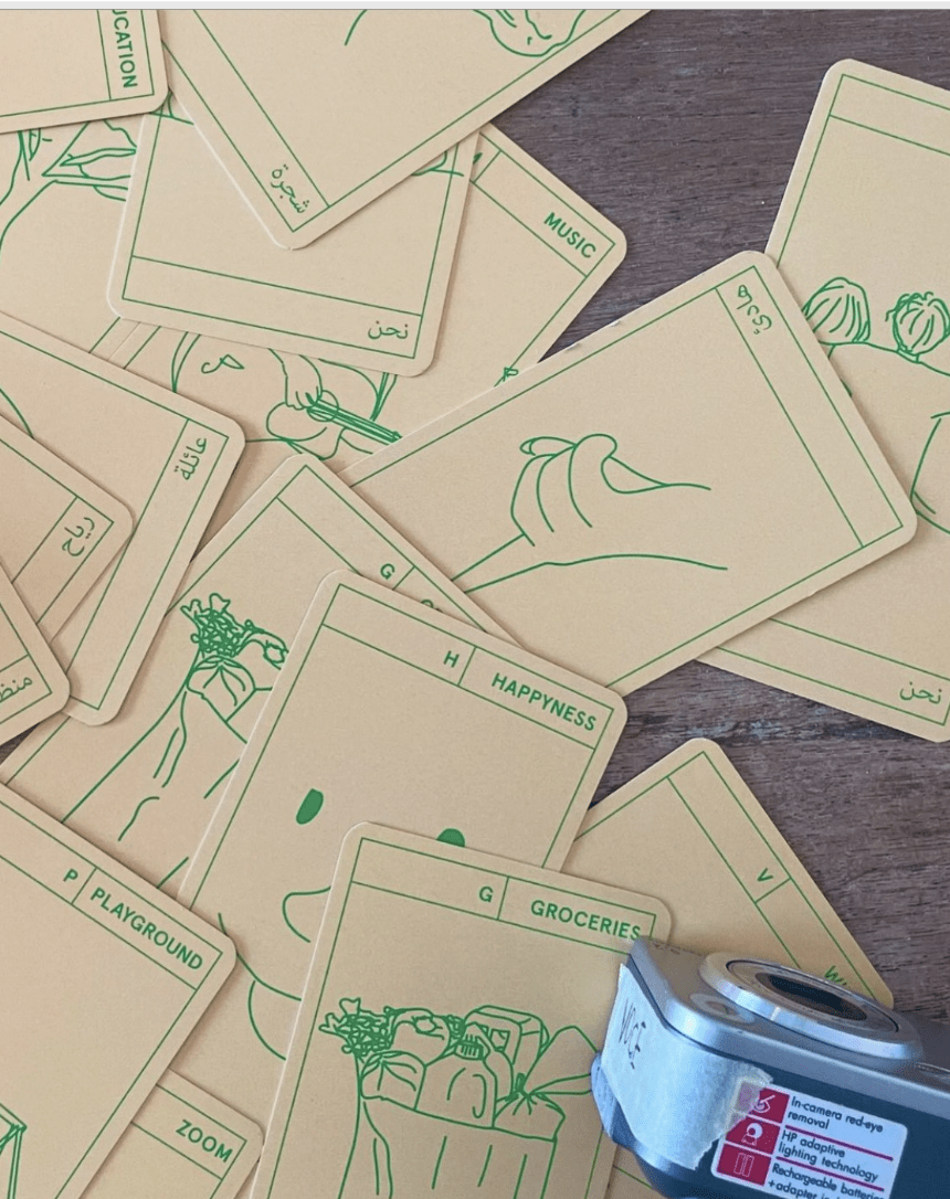 A scattered pile of cards from the alphabet card game created for this project